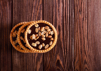 Caramel, peanut and chocolate mini tarts