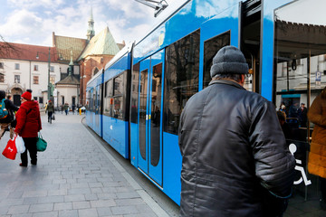 KRAKOW, POLAND - DECEMBER 05, 2019:  Modern low-floor tram on a historic street