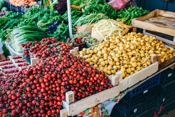 Fresh fruit in the market. Apricots, peaches, cherries, apples