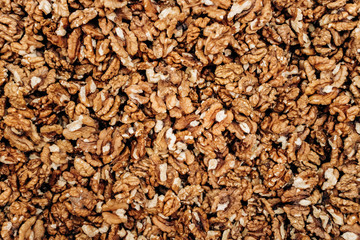 Closeup of big shelled walnuts pile. The background of their shelled walnuts.