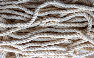 Fototapeta na wymiar Gray nautical rope, closeup background texture, vintage toned photo with retro style