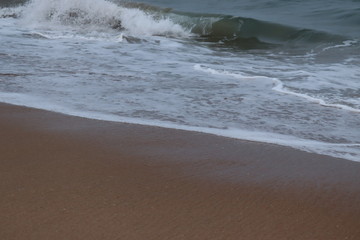 beautiful sand beach.Close up soft wave lapped the sandy beach, Summer Background.