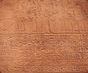 old egypt hieroglyphs carved on the stone