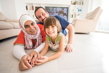 Mother father and son as a happy family at home