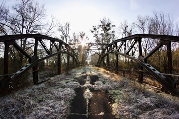 abandoned rusty bridge with ice