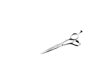 Hairdresser's scissors on a white background