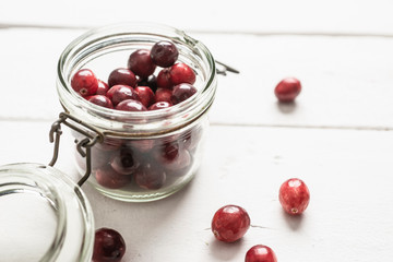 Cranberries on white table