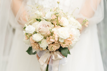 Bridal morning details. Wedding beautiful bouquet in the hands of the bride, selectoin focus