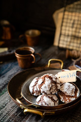 chocolate christmas crinkle cookies in copper plates