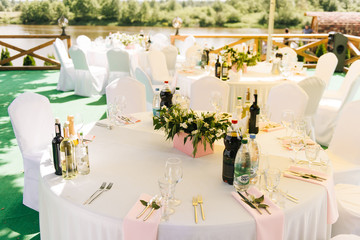 The concept of decor for weddings and holidays, floral arrangements on tables that stand on the street