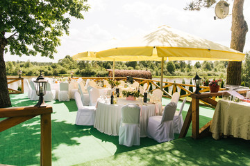 The concept of decor for weddings and holidays, floral arrangements on tables that stand on the street