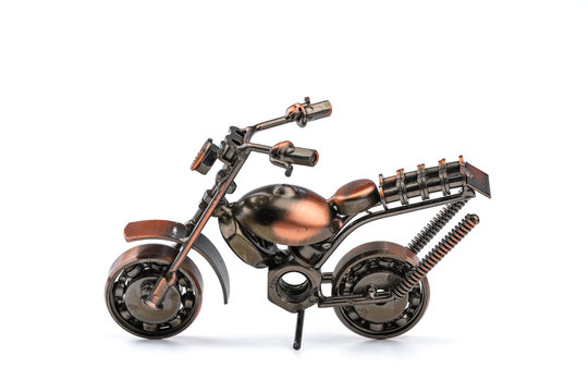 Hand craft of Motorcycle model made by scrap metal pieces isolated on white background. (Image Stacking Technique)