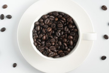 center top view black coffee bean in white cup with white background