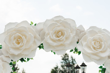 Arch for wedding ceremony. Arch decorated with beautiful big white flowers.  Registration at the place of marriage.