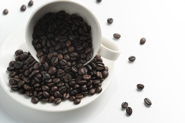 left top view black coffee bean in white cup with white background