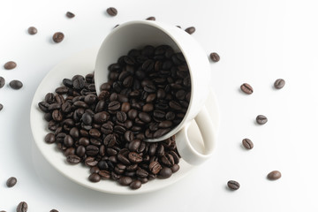 left top view black coffee bean in white cup with white background