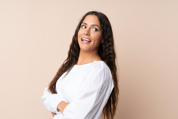 Young woman over isolated background laughing