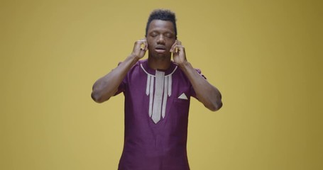 Man covering his ears with his hands