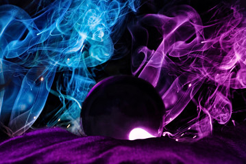 Magic glass ball with blue and purple flame ,product showcase background with magic concept.