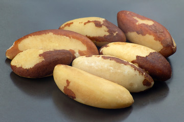 handful of nuts close-up on a dark plate
