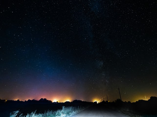 The starry sky and the bright milky way above the village.