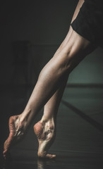 Ballerina in studio dancing bare foot on pointe - 308051173