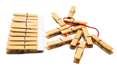 Wooden clothespins in different manner, one group are in orderly ,tidy and neat whereas another group are disorder , messy and confusion represent order and chaos concept on white background