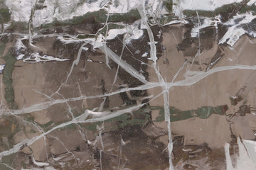 Translucent ice plate with cracks, unique ice winter background