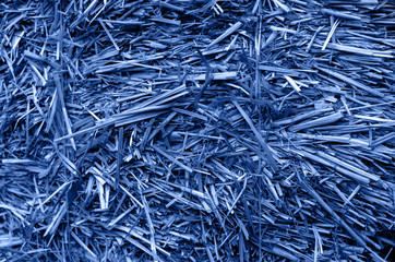 Dry grass-straw. Background for your design. Rustic style. Autumn. The blue coloring.