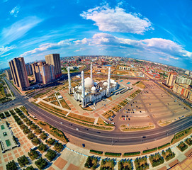 NUR-SULTAN, KAZAKHSTAN - August 11, 2019: Beautiful panoramic aerial drone view to Nursultan (Astana) city center with skyscrapers, Monument Kazakh Eli, Shabyt Palace and Hazrat Sultan Mosque