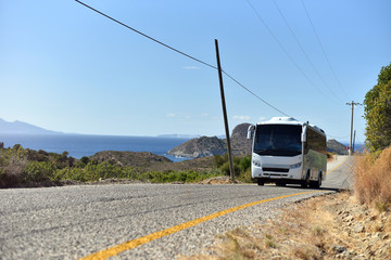Scenic view with middle tourist shuttle bus carries tourists to sea resort is along mediterranean...