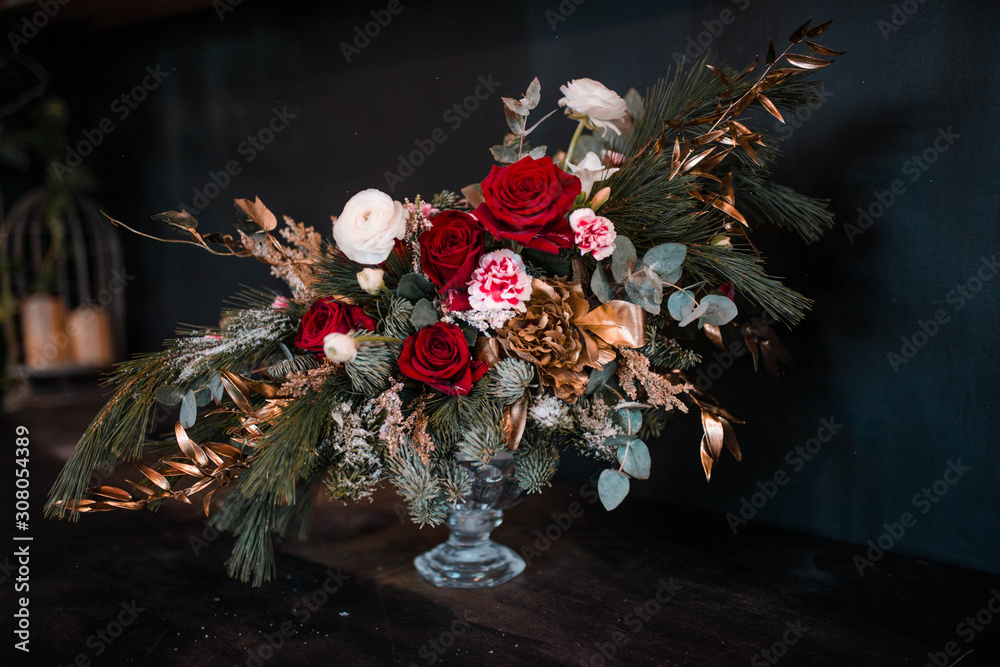 Wall mural bouquet of red roses. Bouquet of natural fresh roses, tulips, anemones, peonies, buttercups, matiola, daffodil, cloves, eucalyptus. Bouquet of flowers decorated with a composition of flowers