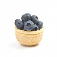 Blueberries in a waffle basket. Vitamins and wholesome foods