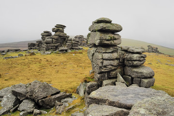 Great Staple Tor with mist rolling in over the hills, Dartmoor National Park, Devon, UK