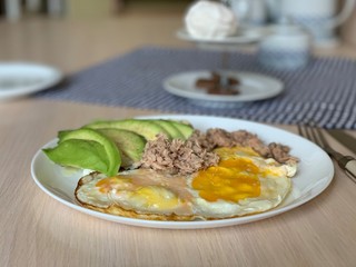 Fried egg with tuna and avocad