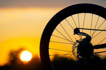 bicycle silhouette on sunset background