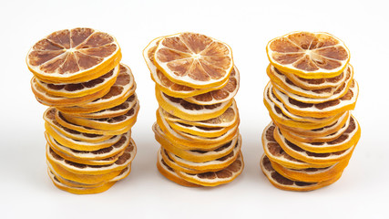 dried lemon slices on a white background. vitamin fruit food