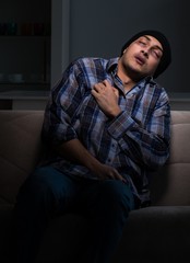 Fototapeta premium The young man in agony having problems with narcotics