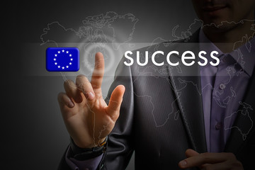European Union success concept. Man pressing virtual button with flag icon
