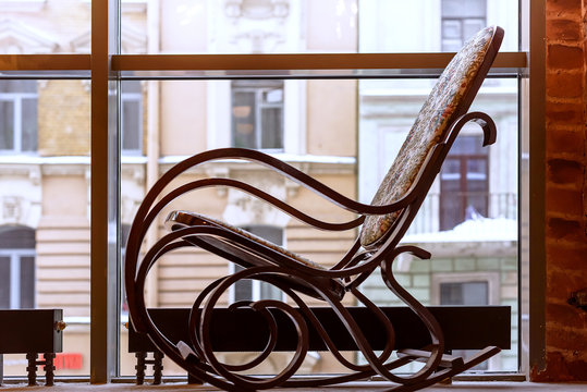 Rocking chair by the window overlooking the city