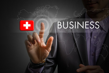 Switzerland Business concept. Man pressing virtual button with flag icon