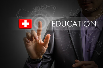 Switzerland education concept. Man pressing virtual button with flag icon