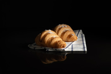 sprinkle Croissant Saree Flour on white towel  with black background