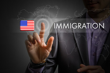 United States of America immigration concept. Man pressing virtual button with flag icon