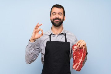 Chef holding a raw meat in zen pose