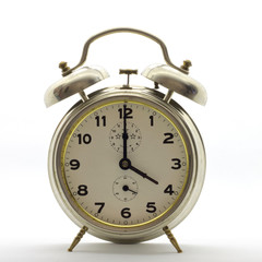 Old-style alarm clock, metal, it's four o'clock.