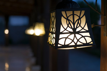 Street lamps on wooden poles. Beautiful street lighting
