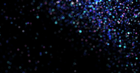 Flying dust particles on a black background