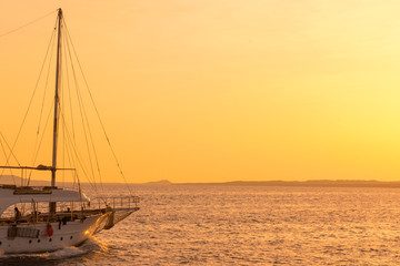 Sunset at sea. toned. Yacht in the sunset. copy space