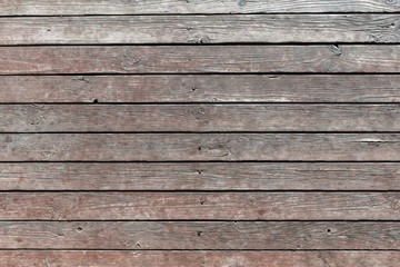 thin horizontal wooden texture wall of rural house. Old dirty panels background